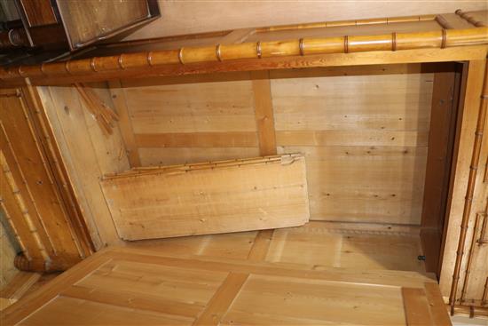 A faux bamboo mirrored cabinet with shelves W.100cm approx.